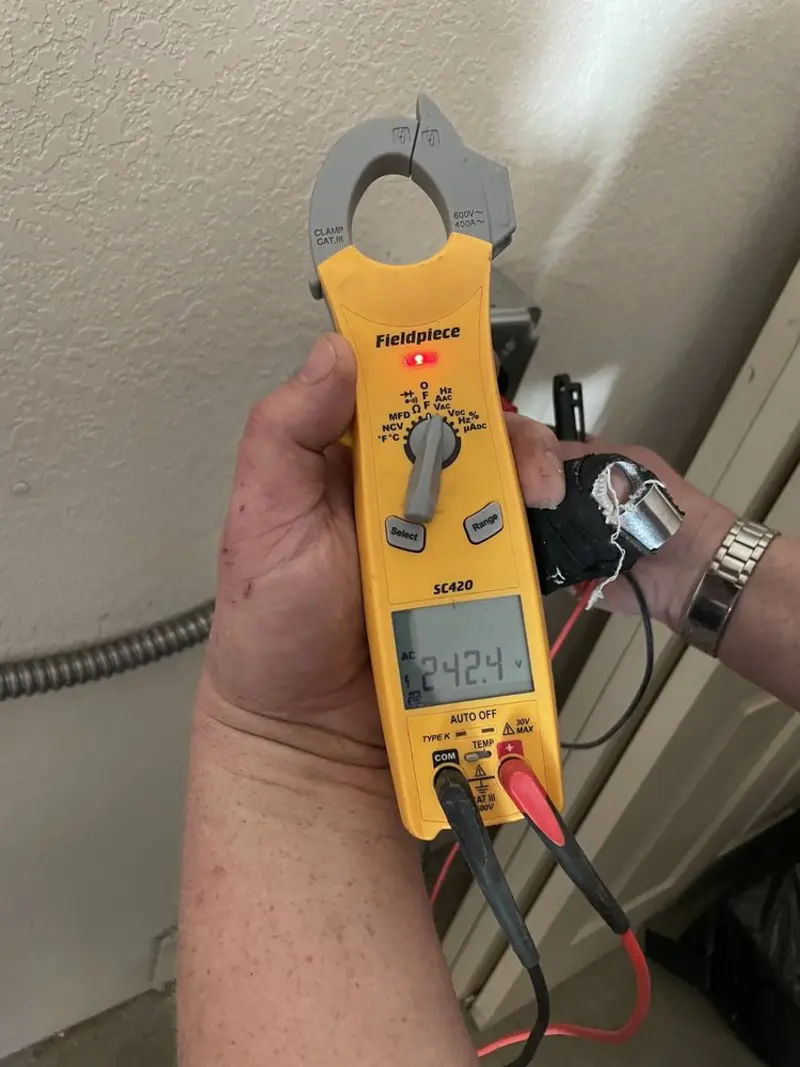 Voltage testing with clamp meter during Electrical Installation Services in Fort Collins